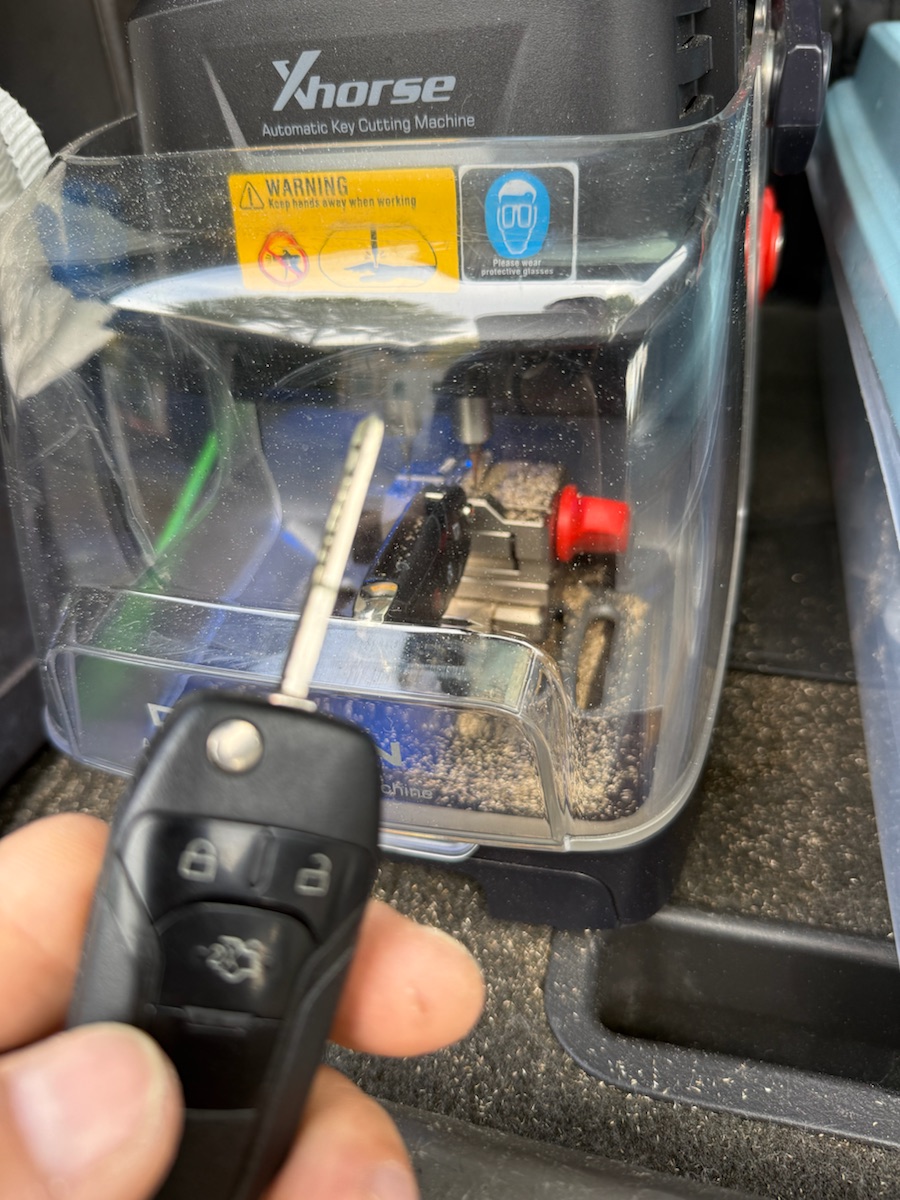 Ford Fusion — key blade cut on the Xhorse key-cutting machine in the van.