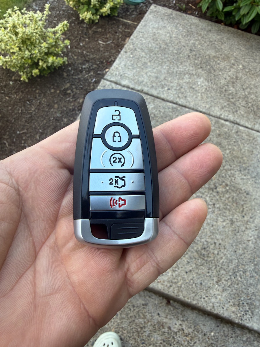 Ford 5-button smart key with remote start — one of the keys we program.
