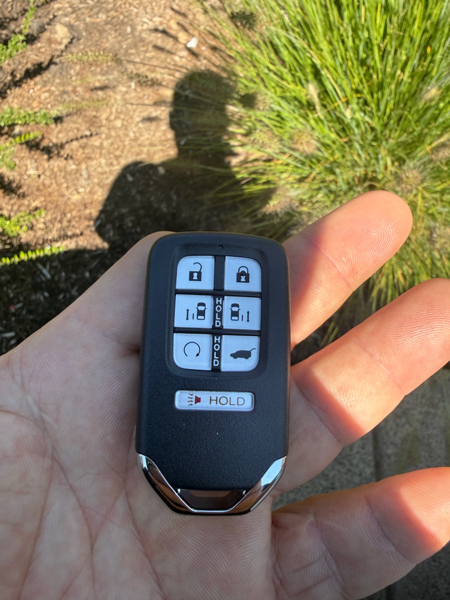 Honda 6-button smart key with power sliding doors (Odyssey) — one of the keys we carry.