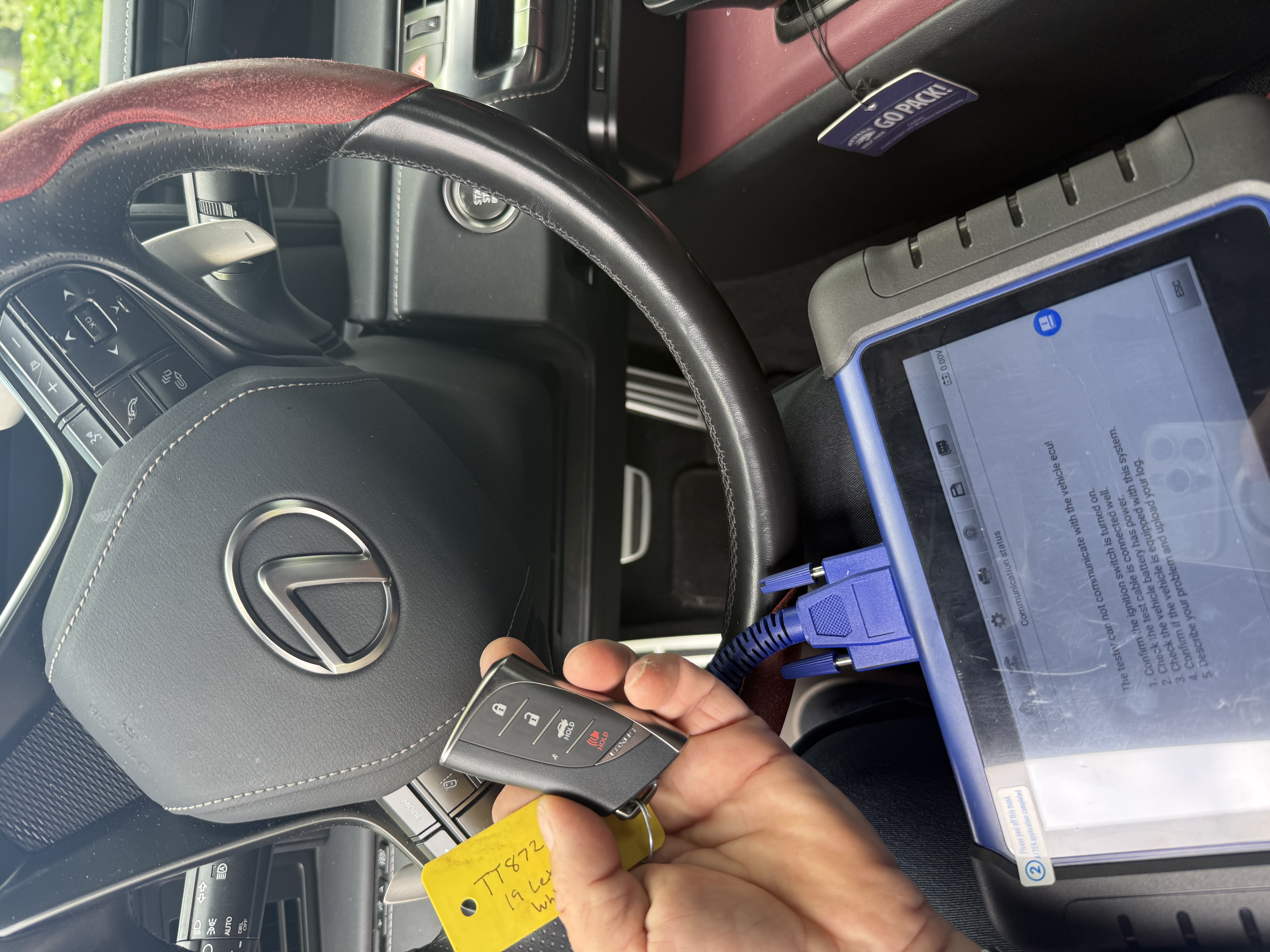 Locksmith programming a car key with Autel IM508