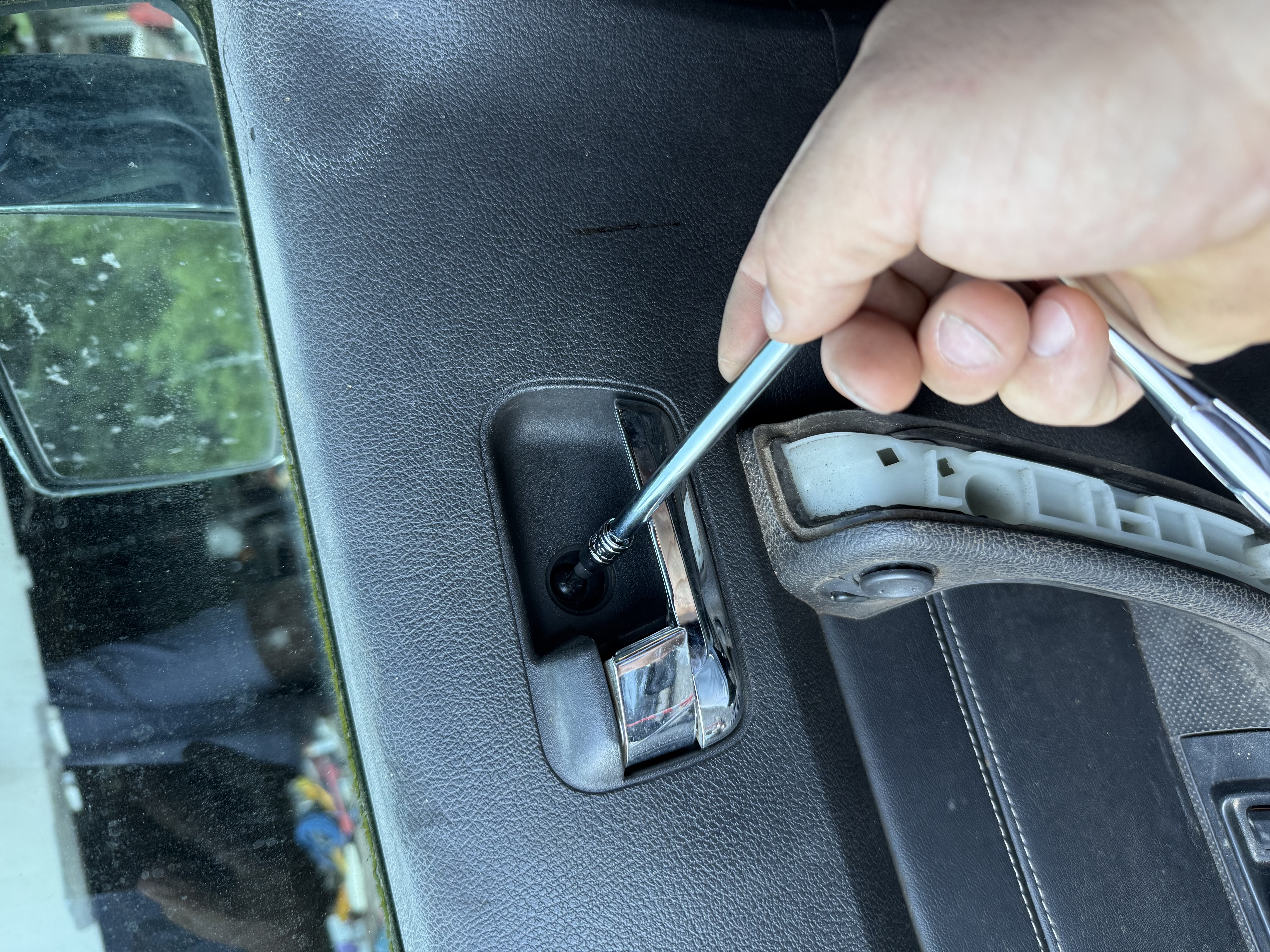 Locksmith with pick opening car door
